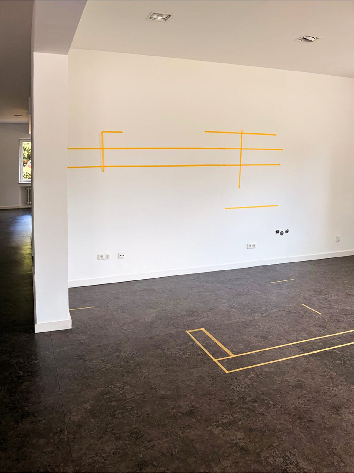 Markings on the wall show the position of the future furnishings